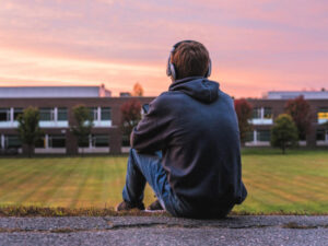 box with headphones looking out